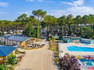 an aerial view of a resort with a swimming pool at Camping Officiel Siblu Les Dunes de Contis in Saint-Julien-en-Born