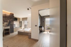a bedroom with a bed and a large mirror at Hotel Castel Mani in San Lorenzo in Banale +176 photos