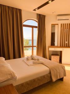 Voodi või voodid majutusasutuse Hotel Meta Ksamil toas
