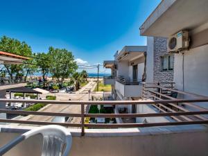 a balcony with a view of the ocean at Prassas Sea View in Nea Potidaea