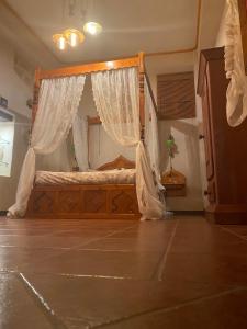 Кровать или кровати в номере Elafusa Luxury Apartment
