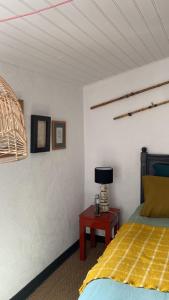 A bed or beds in a room at La Terrasse du Bois Plage