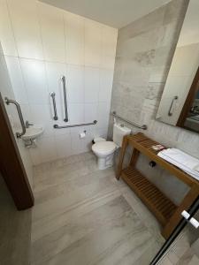a bathroom with a toilet and a sink at Golden Towers Hotel in Macaé +17 photos