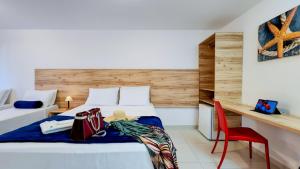 Postel nebo postele na pokoji v ubytování Hotel Refugio