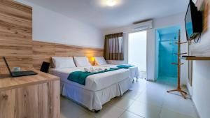 Postel nebo postele na pokoji v ubytování Hotel Refugio