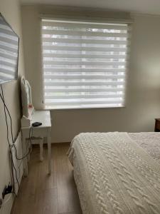 Posteľ alebo postele v izbe v ubytovaní Apart Hotel R&P Depto A