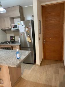 Kuchyňa alebo kuchynka v ubytovaní Apart Hotel R&P Depto A