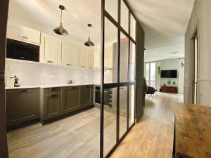 Kuchyň nebo kuchyňský kout v ubytování Bioves en Duplex