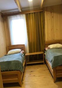 Letto o letti in una camera di Hotel Chubezeni