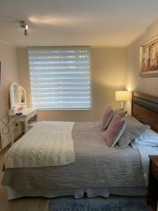 מיטה או מיטות בחדר ב-Apart Hotel R&P Depto B
