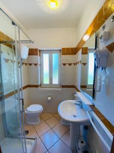 Kylpyhuone majoituspaikassa Casevacanza Trentovamare