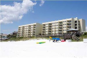 a beach with a large building and a hotel at Beach House 603D- Rest Ashore in Destin