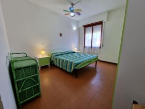 Postel nebo postele na pokoji v ubytování la stella gialla sul mare