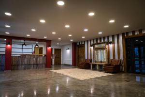 a large lobby with two chairs and a table at Hotel Hacienda Dorotea in Puerto Natales