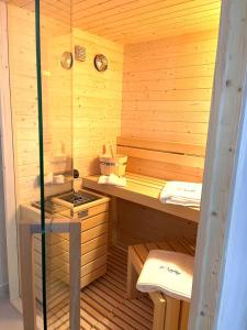 a wooden sauna with a stove in it at B&B suite spa la Sciantosa in Cosenza