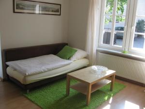 a small living room with a couch and a table at Kruft Veldenz in Veldenz