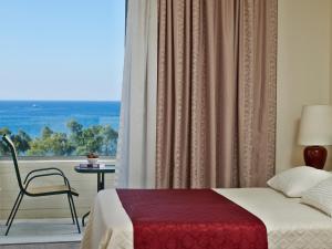 Postel nebo postele na pokoji v ubytování Amarilia Hotel