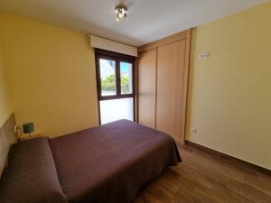 Łóżko lub łóżka w pokoju w obiekcie Foz Playa Rapadoira - 3 dormitorios