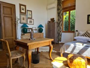 a bedroom with a desk and a bed and a window at Heritage Apartment Park Royal Residence in Opatija