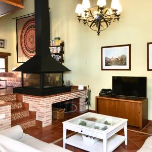TV a/nebo společenská místnost v ubytování Casa Roble