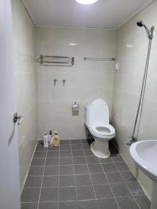 a bathroom with a toilet and a sink at Able Guesthouse Hongdae in Seoul