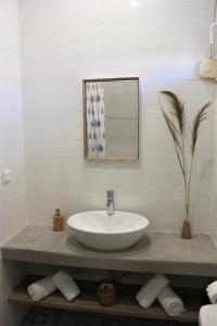 a bathroom with a sink and a mirror at House Fedra in Potos +61 photos