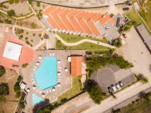 an overhead view of a building with a swimming pool at Hotel Vale Da Telha in Aljezur