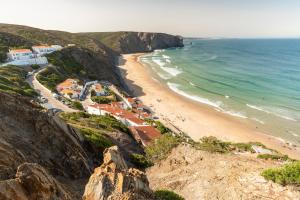 an aerial view of a beach and the ocean at Hotel Vale Da Telha in Aljezur