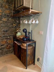 a kitchen with a table with a blender on it at La Chicca del Centro in La Spezia