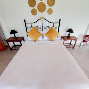 
Cama o camas de una habitación en The Golden Frog Inn
