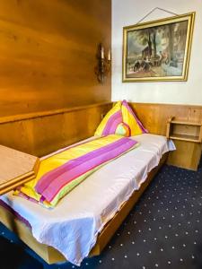 Posteľ alebo postele v izbe v ubytovaní Alpenheim Simone