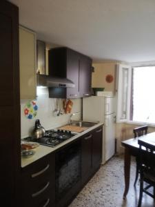 a kitchen with a sink and a stove top oven at Monolocale La Chicca in Castellammare del Golfo