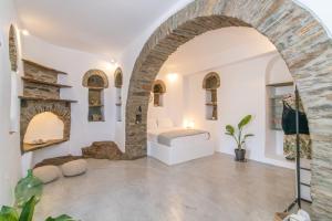A television and/or entertainment centre at Livadi house Tinos 2 katwi