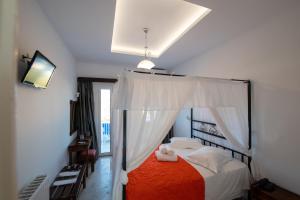 Postel nebo postele na pokoji v ubytování Hotel Lodos