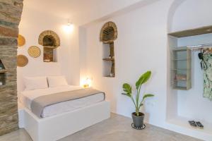 Posteľ alebo postele v izbe v ubytovaní Livadi house Tinos 2 katwi