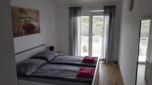 Posteľ alebo postele v izbe v ubytovaní Katarina + 9 fotografií