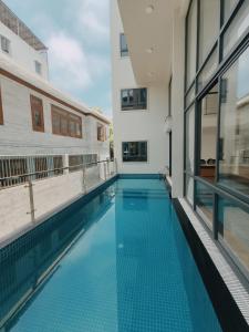 a swimming pool in the middle of a building at Camellia Family Suites in Da Nang