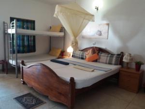 Postel nebo postele na pokoji v ubytování Embiente Guest House