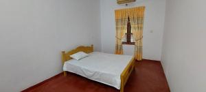 Postel nebo postele na pokoji v ubytování Shiven Homestay