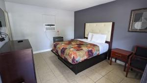 Ліжко або ліжка в номері TOCCOA MOTEL