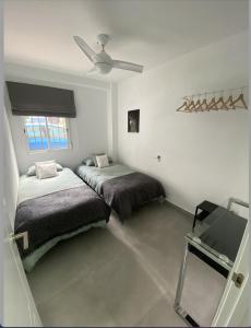 Katil atau katil-katil dalam bilik di Morgan apartamentos Marbella centro