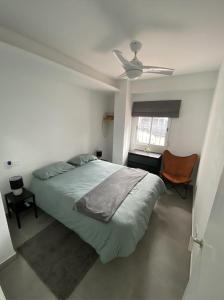 A bed or beds in a room at Morgan apartamentos Marbella centro