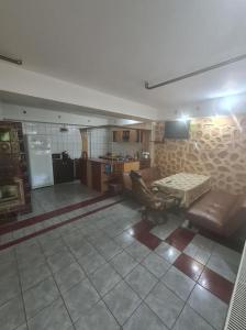 a living room with a couch and a table at Casa Beatrice in Eşelniţa +19 photos