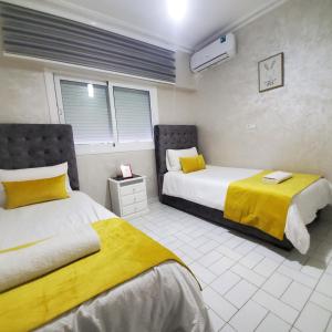 Postel nebo postele na pokoji v ubytování Ocean View Apartment with Airco