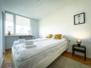 Posteľ alebo postele v izbe v ubytovaní COCO Apartments Jagiellońska 10