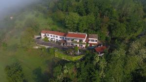 an aerial view of a house on a hill at B&B Casa Fossello in Montabone
