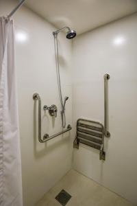 a bathroom with a shower stall and a toilet at Comfort Suites Brasília in Brasília