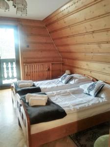 Posteľ alebo postele v izbe v ubytovaní Willa Tadeusz Zakopane