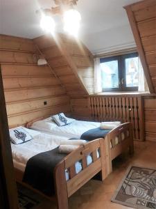 Posteľ alebo postele v izbe v ubytovaní Willa Tadeusz Zakopane