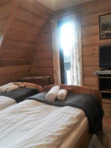 Posteľ alebo postele v izbe v ubytovaní Willa Tadeusz Zakopane